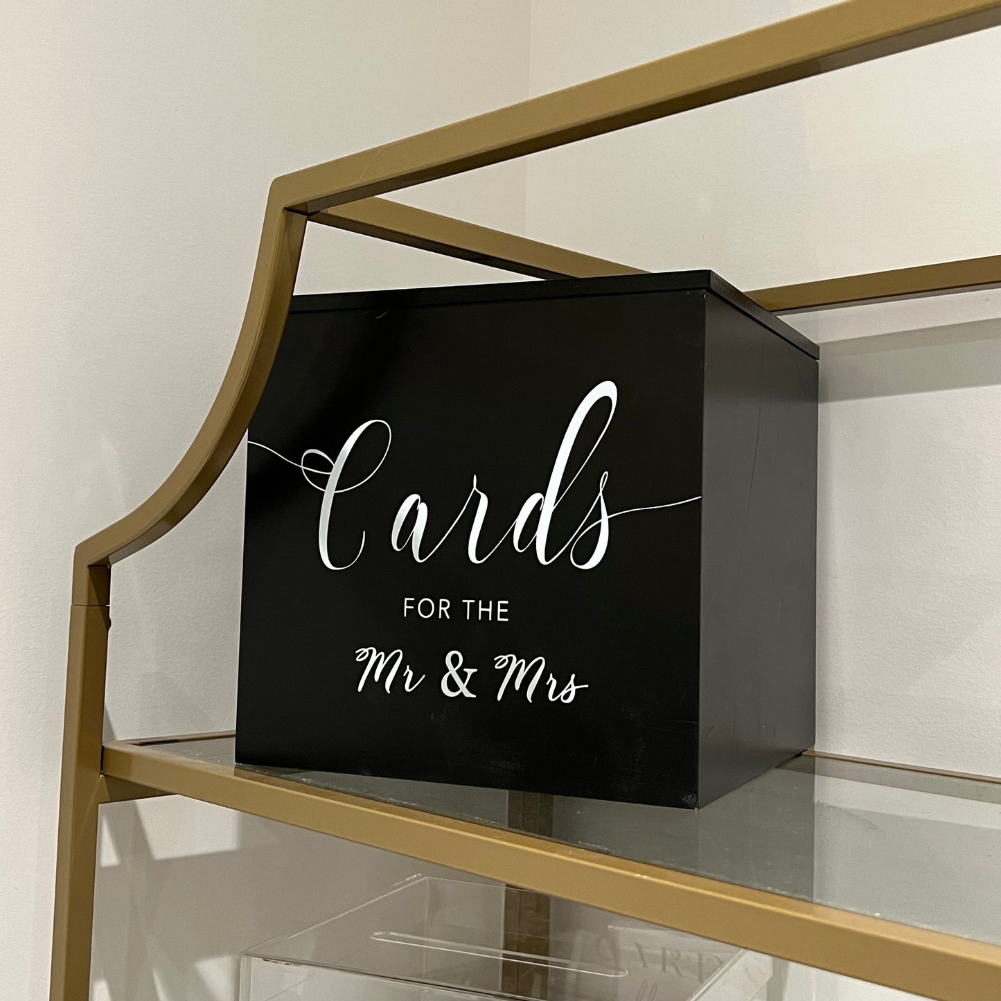 Elegant black wooden card box with white lettering for wedding decor.