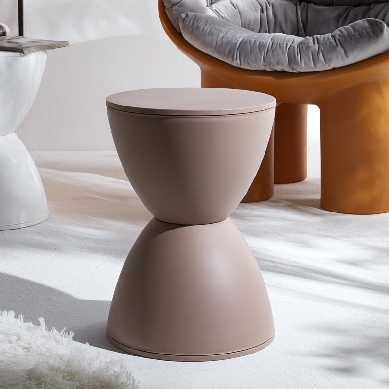 Beige Nordic side table/stool used as a side table in a modern living room.