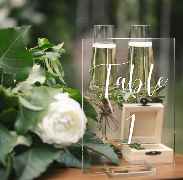 Acrylic Table Numbers with Holders Displayed at an Event