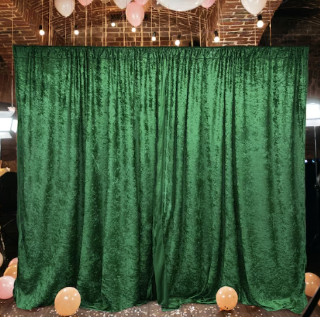 Luxurious emerald green velvet backdrop for events and photo shoots.