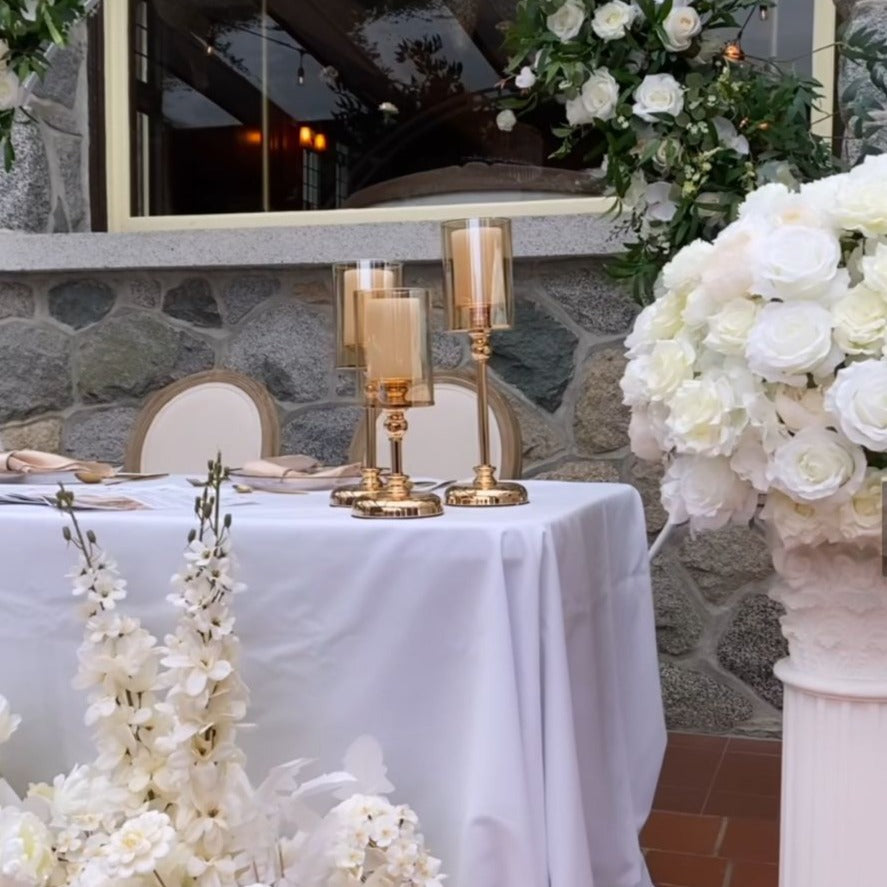 Set of 3 golden candle holders in varying heights.