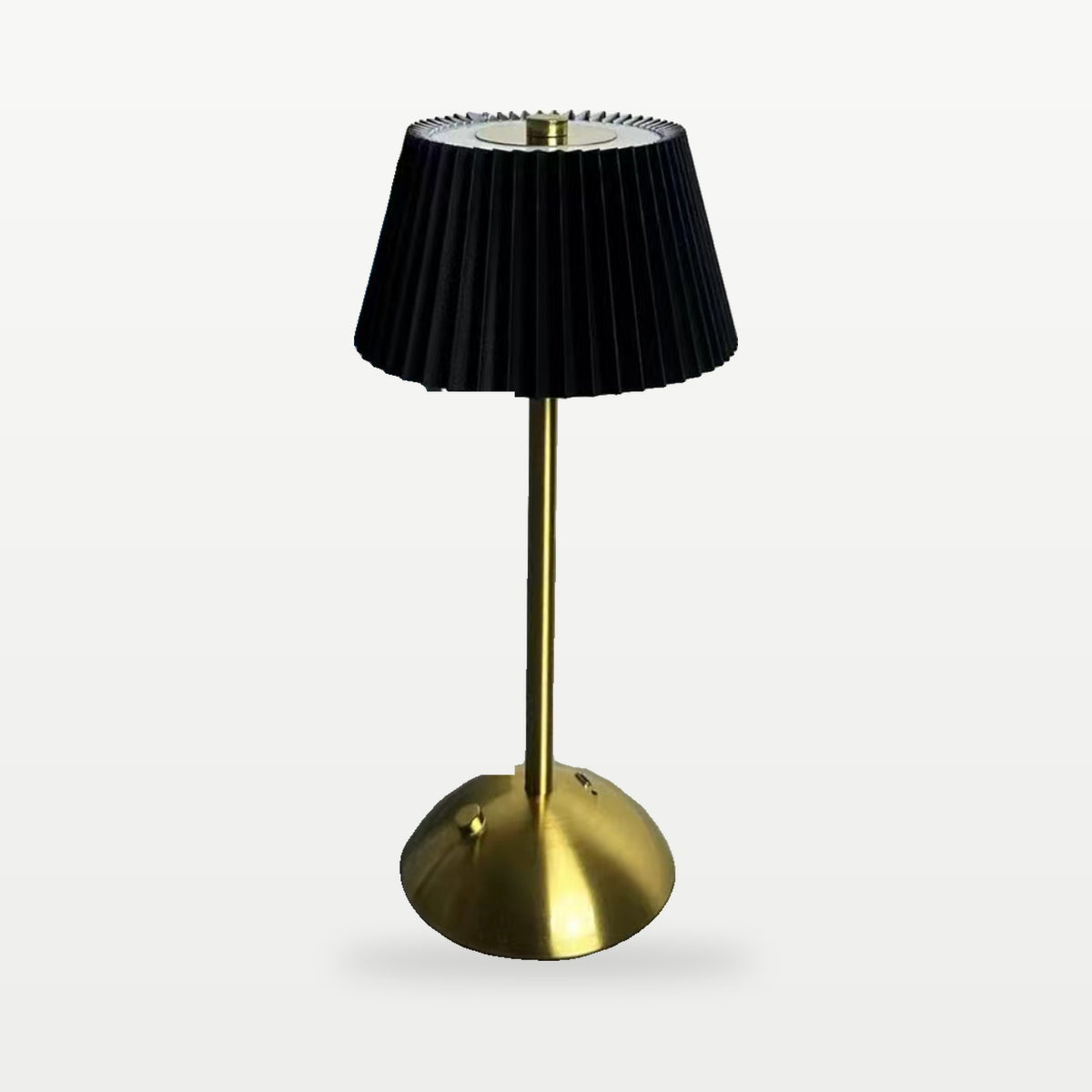 Cordless pleated table lamp with black shade and gold base