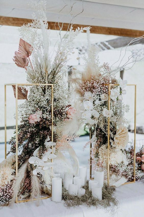 Elegant gold stand with floral centerpiece for event decor.