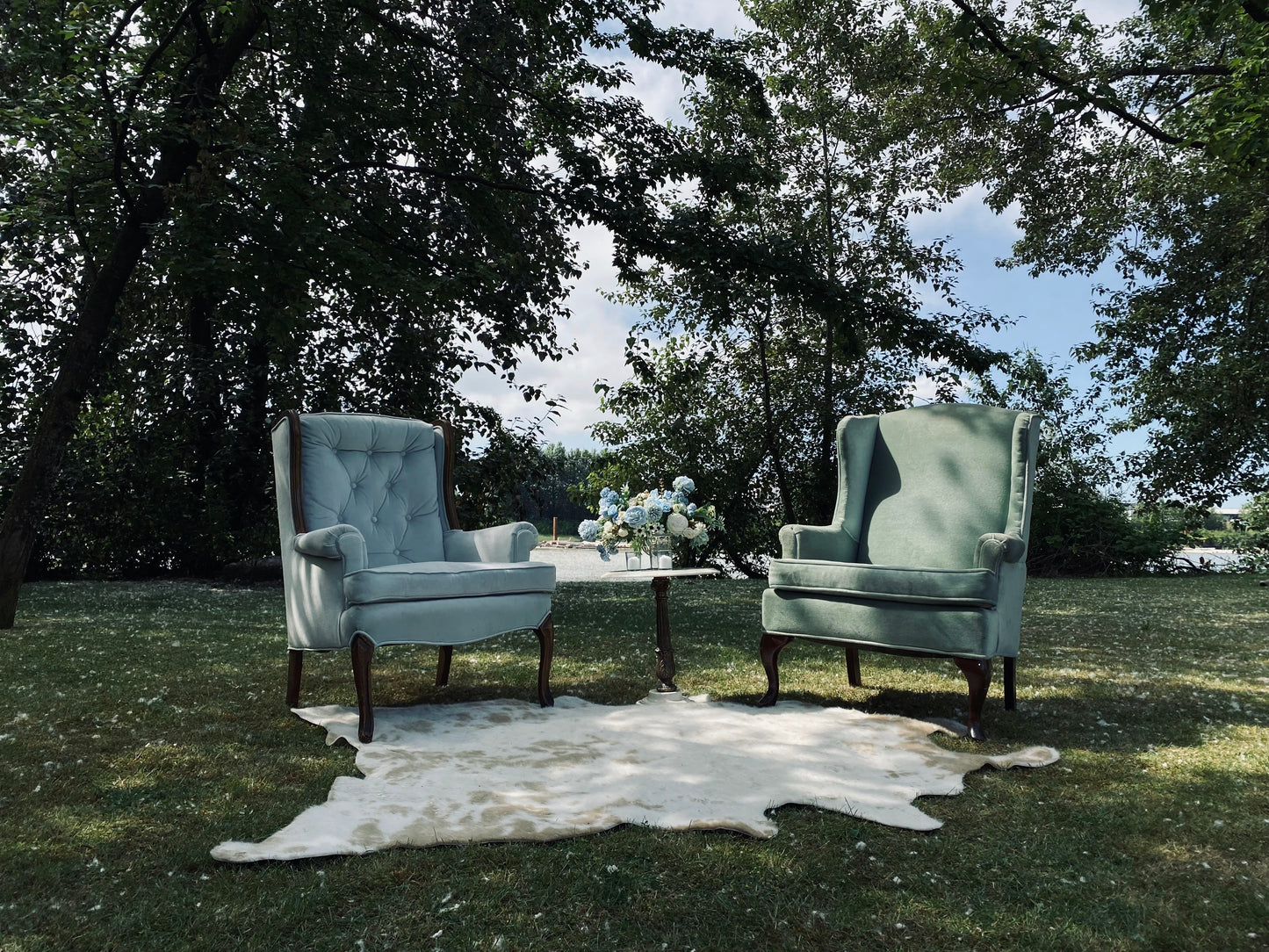 Light Teal Lounge Chair in a sunlit conservatory.