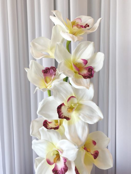Elegant white and pink silk orchids on stem, perfect for versatile event decor.