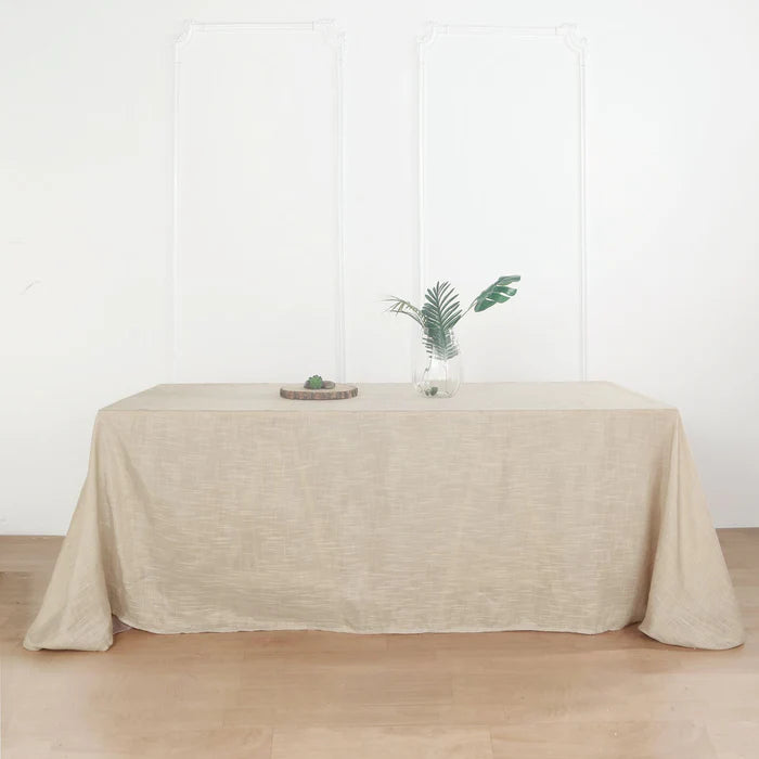Elegant Event Setup with 90'' x 156'' Beige Woven Rectangular Tablecloth