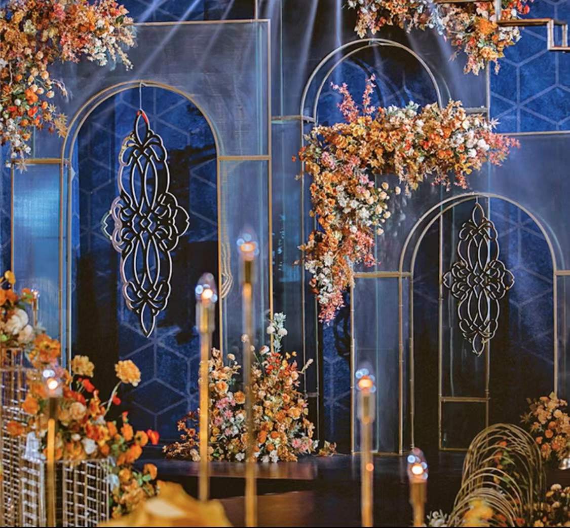 Grande Lancet Arch adorned with golden and blue decorations for a luxurious event backdrop