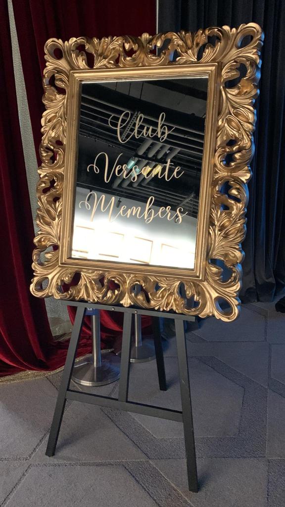 Custom decal sign on an ornate frame for a corporate event