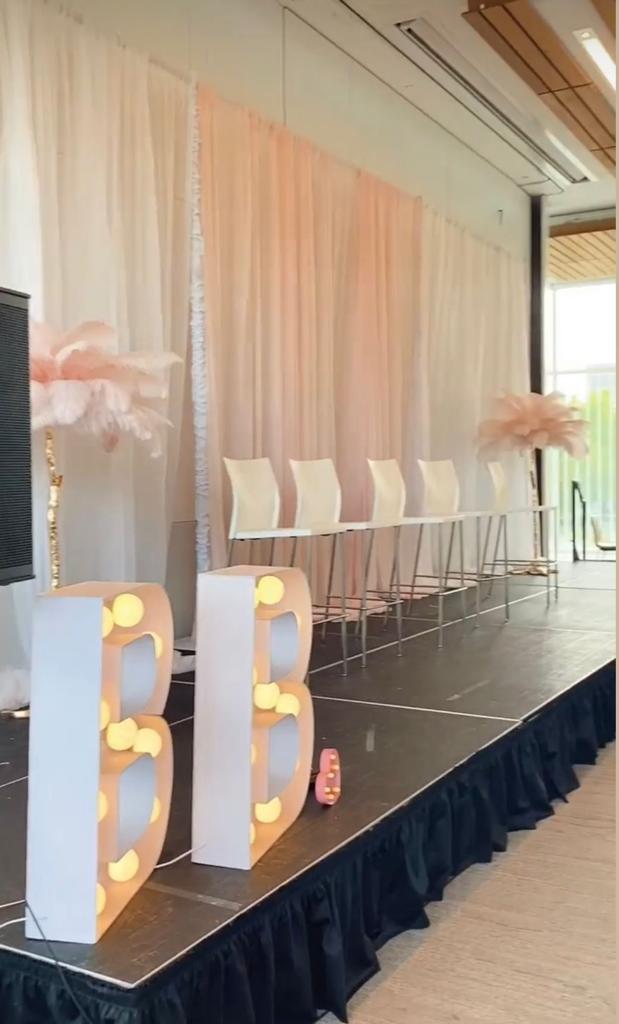 Bright marquee letters creating a festive atmosphere at an event.