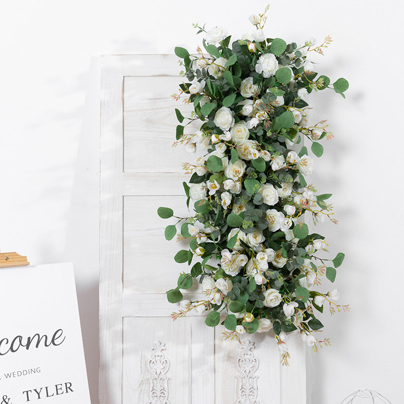 Elegant white and greenery silk floral piece for event decor.