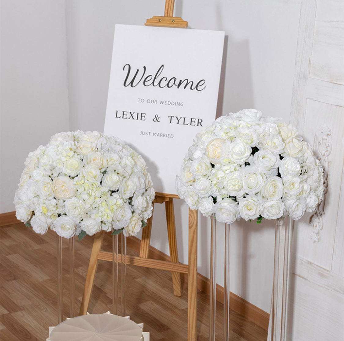 Elegant white silk round floral arrangement for event decor.