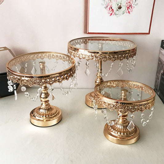 Gold Cake Stands with Crystal Accents Displayed on a Table