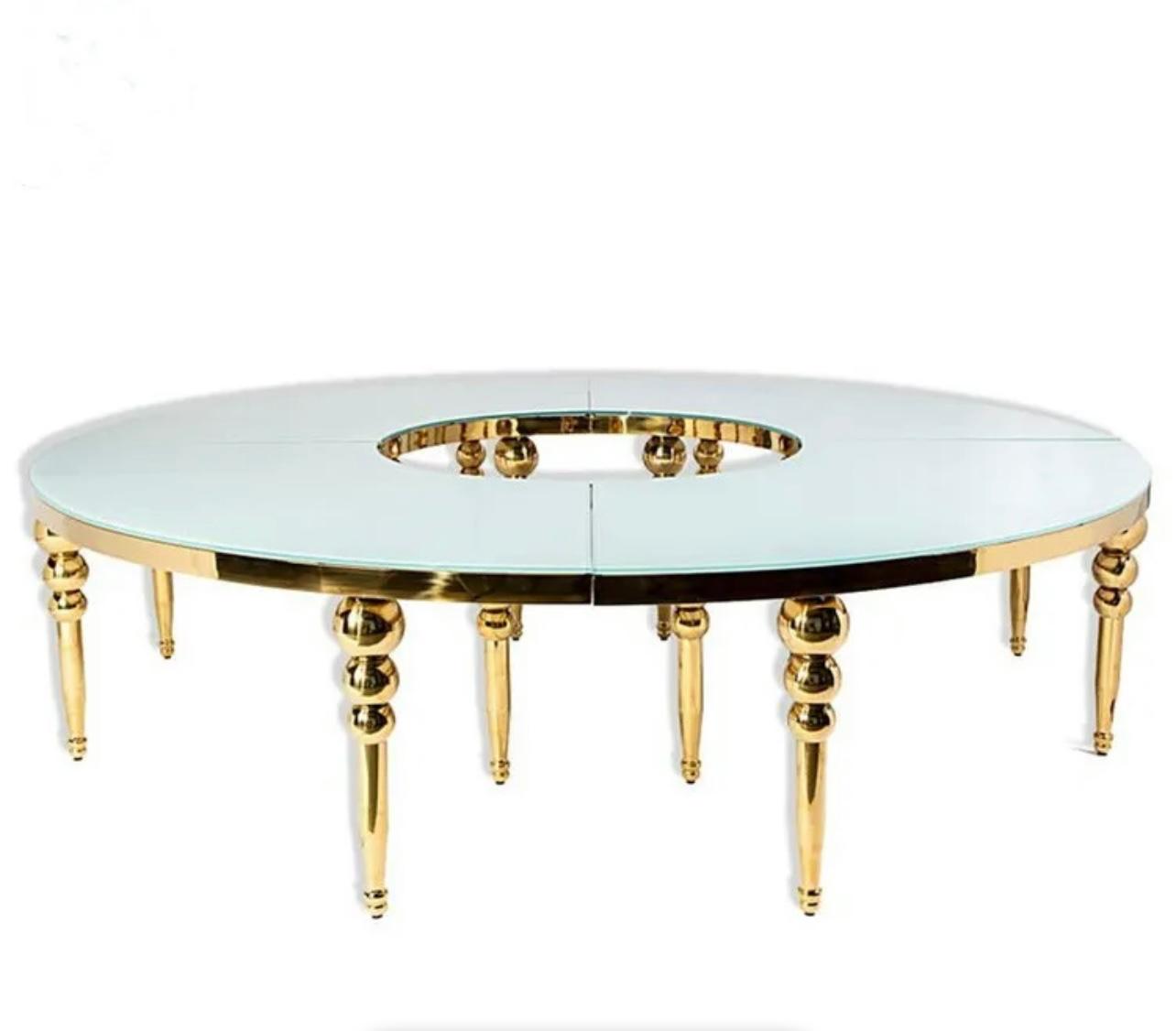 Luxurious glass and gold large O shape table with elegant design, perfect for upscale events.