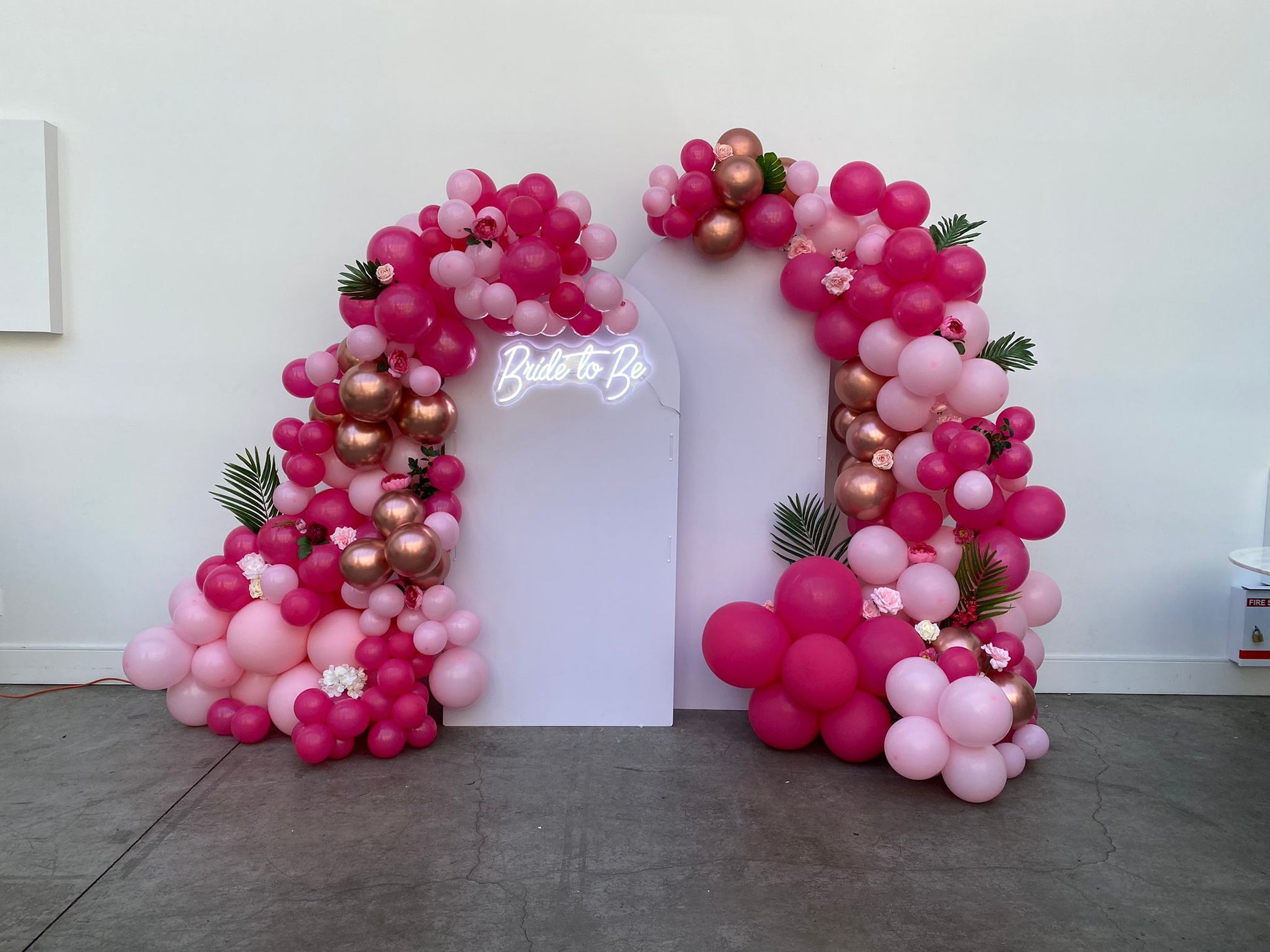 ink balloon arch setup for an event.