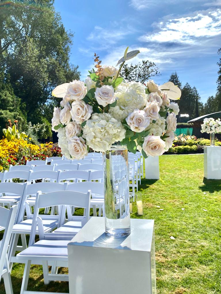 Glossy white podiums of varying heights for event decoration.