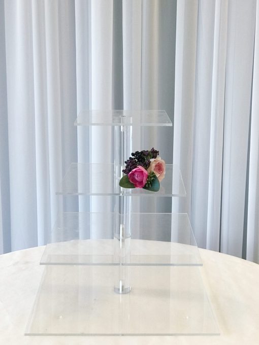 Elegant Acrylic Cupcake Stand Displaying Cupcakes at a Wedding