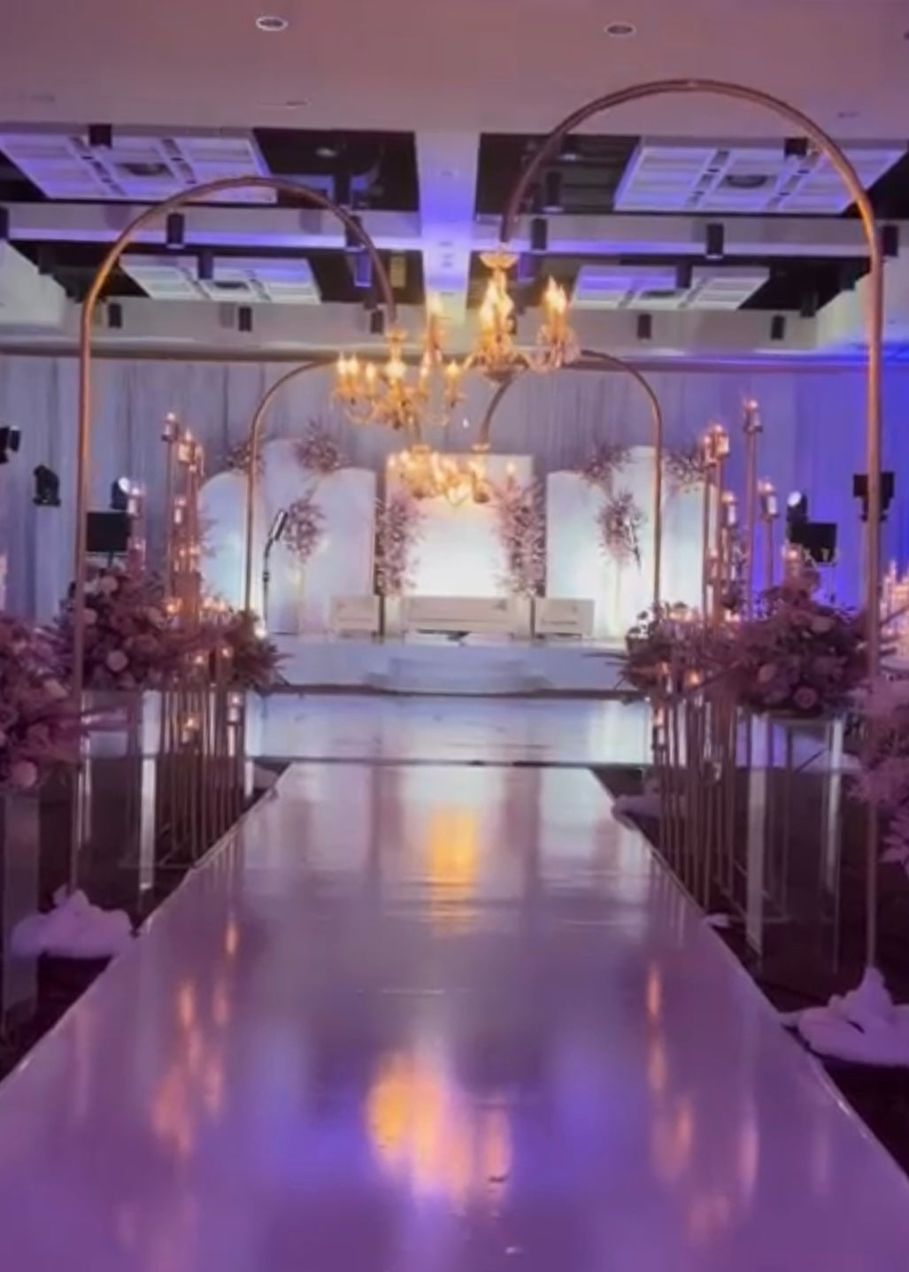 Chandelier with stand setup at a wedding reception, adding a touch of elegance.